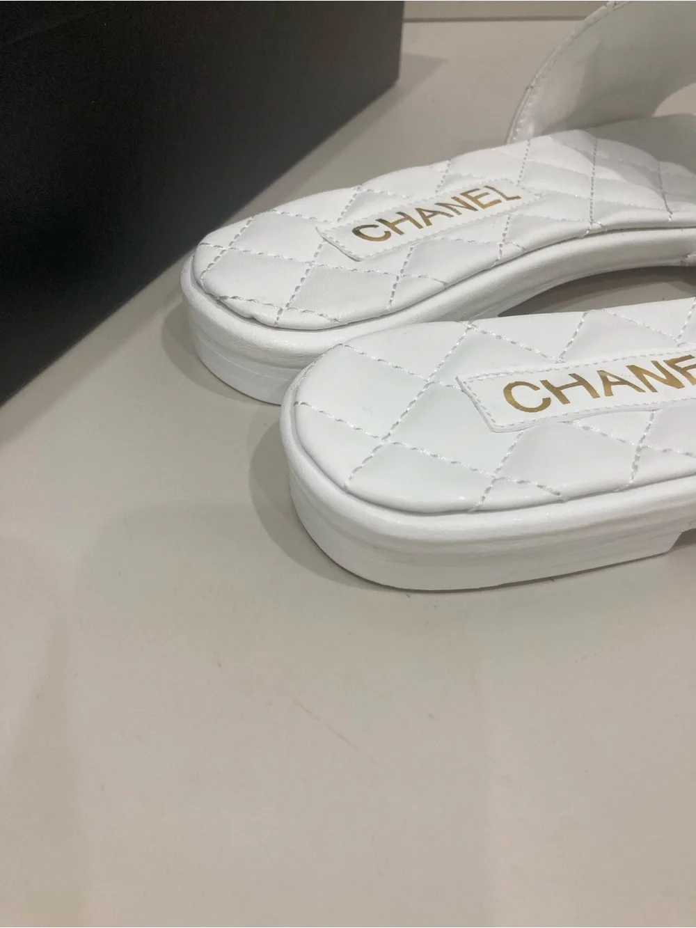 CHANEL White Quilted Slide Mules with Gold CC Chain Logo